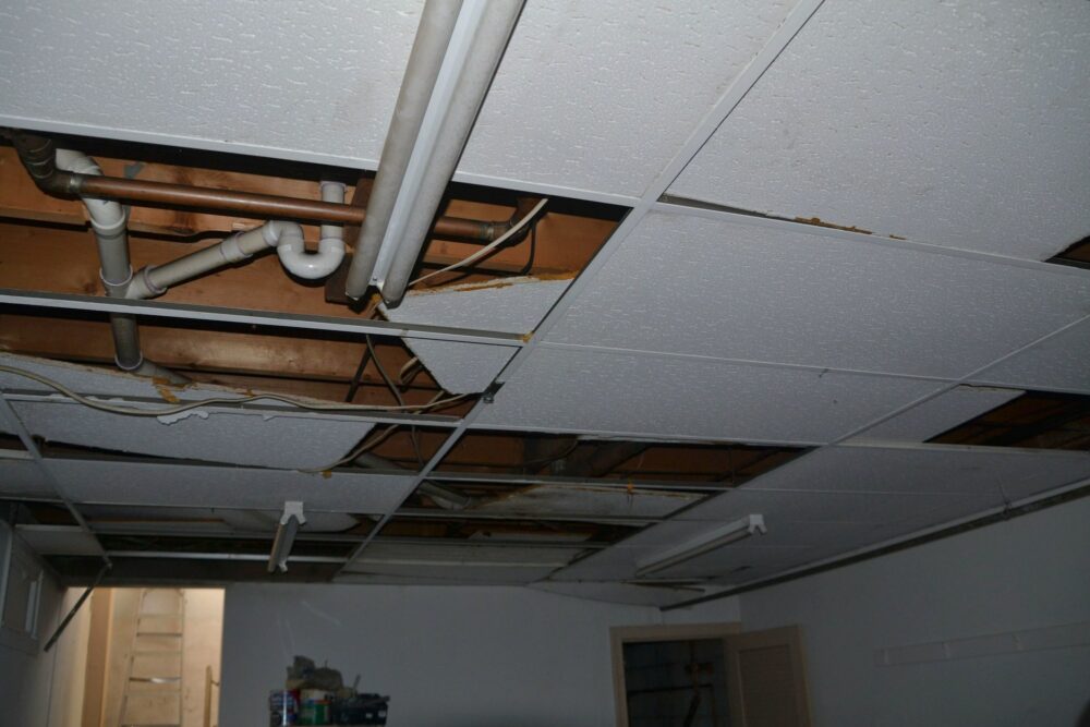 Water damage to a drop ceiling due to a fire. Time to file an insurance claim.